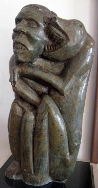 sculpture:baboon fighting man